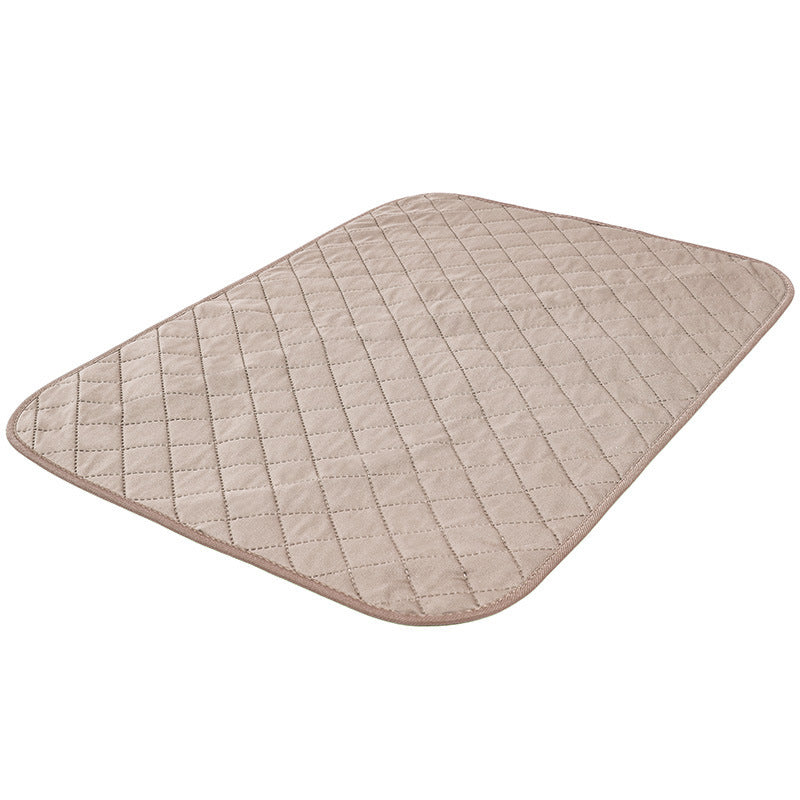 Quilted beige mat on a white background