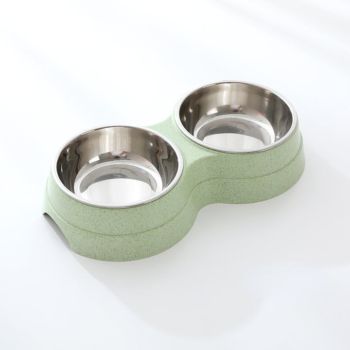 Green pet bowl with two stainless steel compartments on a white background