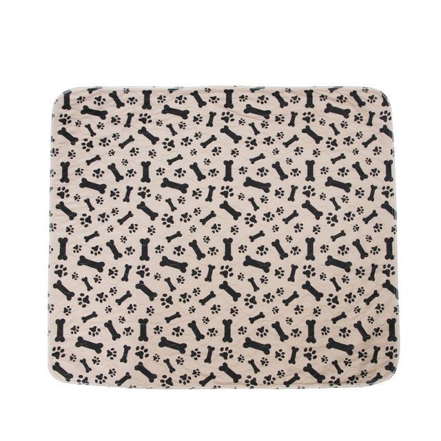 Beige mat with black bone and paw pattern on a white background