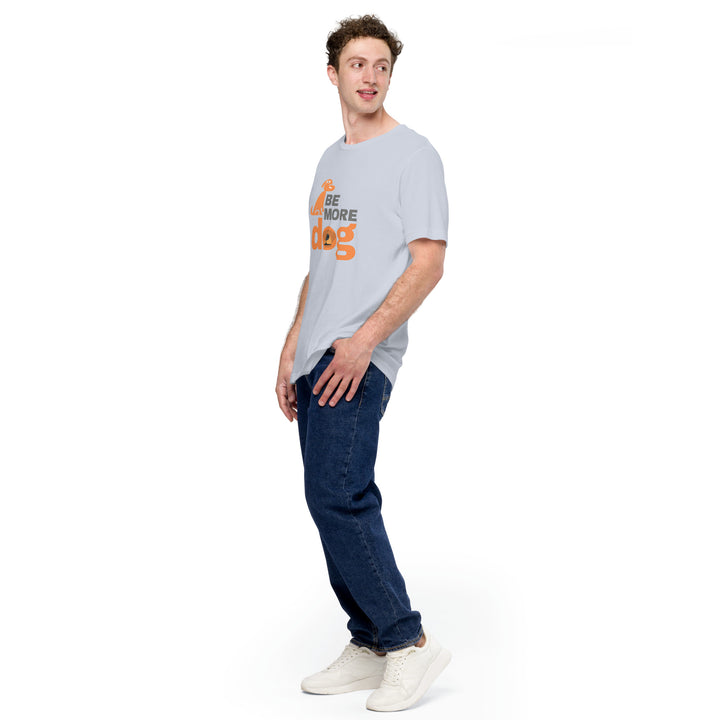 Man wearing a light gray t-shirt with text and dark blue jeans on a white background