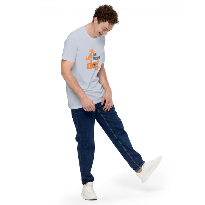 Man wearing a light gray t-shirt with text and dark blue jeans on a white background